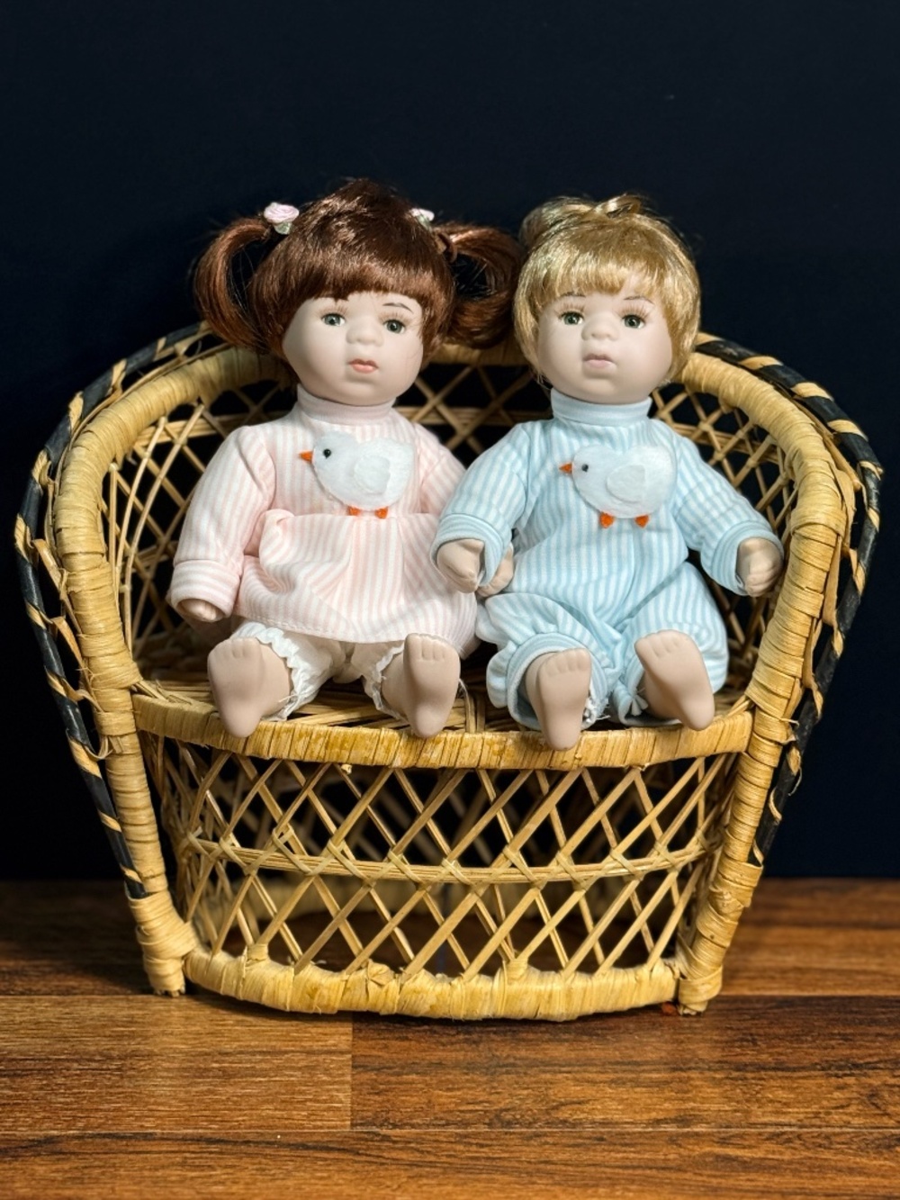 Collectible Dolls on Wicker Bench
